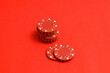 © Rebecca Peloquin/Stocksy - red poker chips stacked