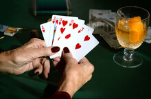 Woman Playing Poker Holds Flush 