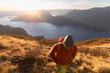 © Michela Ravasio/Stocksy - Hiker at sunset