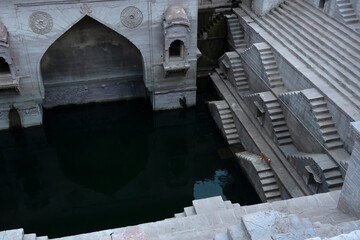 Wall Mural - Toorji's Step Well, Toorji ki Jhalara, Toorj ki jhalra, was built in 1740s.Hand carved step well bulit to provide water to the local people in the desert. Ancient architecture Jodhpur,Rajasthan,India.