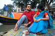 © Dream Lover/Stocksy - Young Indian couple enjoying romantic moments sitting beside River