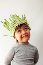 Kid With A Crown Of Fresh Asparagus