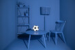 © Dima Sikorski/Stocksy - A soccer ball in the bleached blue interior of a living room