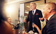 © Coetzee/peopleimages.com - Man, restaurant party and night for toast with friends, business executive team and happy for success. New year, ceo celebration talk and people at gala with champagne, motivation and work community