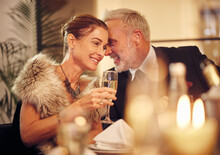 Woman, Man And Whisper At Dinner, Party Or Restaurant For Celebration In Night With Smile, Happy And Gossip. New Year, Fine Dining Or Gala Event With Champagne, Conversation And Romantic Secret Love