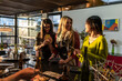 © Manu Prats/Stocksy - Multiracial friends cooking dinner