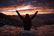 © Ibai Acevedo/Stocksy - Triumphant happy woman on mountain summit