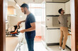 © Luis Velasco/Stocksy - Gay Couple Cooking In The Kitchen At Home.
