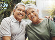 © Coetzee/peopleimages.com - Senior african couple, smile portrait and hug for love, support and care in relationship embrace, bond or happiness outdoor. Romance, happy marriage or elderly black man and woman on holiday together