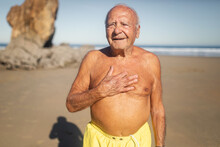 Senior Man In Swimming Trunks On The Beach