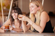 © Lune V A/peopleimages.com - Relax, friends and coffee with women in cafe for happiness, social and lunch break. Summer, reunion and bonding with girl and cup of tea at table in restaurant for support, smile and communication