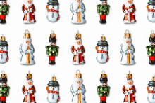 A Snowman, Santa Claus And Nutcracker Baubles
