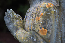 Hands Of An Angel Statue In A Graveyard