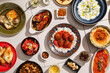 © Kate Ili/Stocksy - Table full of delicious food