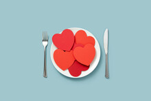 Lots Of Red Paper Hearts On White Plate.