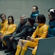 group of people interacting bodies dressed in latex force majeure movie triangle of sadness scene of a Ruben stlund movie 