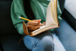 © Serena Burroughs/Stocksy - black teenage girl sitting down writing in a journal