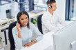 © Joshua A/peopleimages.com - Customer service, call center and happy woman at desk while consulting online for CRM, contact us or sales. Support team people at office help desk for telemarketing and communication with a smile