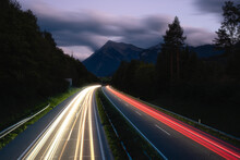 Light Trails On Highway And Mountain