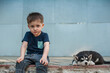 © Sveta SH/Stocksy - Little boy and Husky puppy