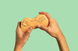 © Pixel Stories/Stocksy - Hands holding gaming gamepad controller