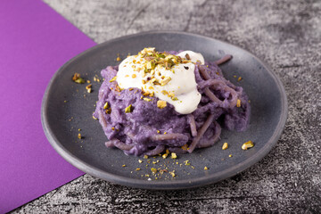 Wall Mural - spaghetti with cream of purple cabbage and cheese.