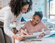 © Lumeez/peopleimages.com - Tablet education, teacher and kid learning, writing and digital support, helping and classroom mentor. Black woman or person teaching child on technology in English, language or creative development