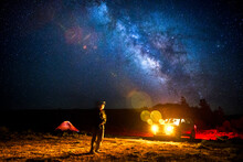 Milky Way Over Man Looking At SUV During Night, Koosharem, Utah, USA