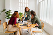 © Nuria Seguí/Stocksy - Coworkers In Business Meeting