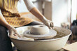 © Pedro Merino/Stocksy - Female artisan shaping clay in a pottery workshop