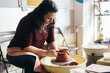 © Pedro Merino/Stocksy - Craftswoman Making Clay Bowl