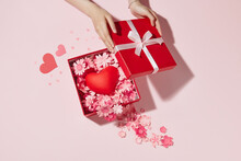 Gift Box With A Red Heart Inside On Pink Backgrpund Valentine Day.