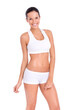 © peopleimages.com - A fit young woman in gym wear smiling and posing  isolated on a PNG background.