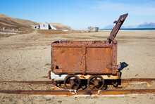 Remains Of Narrow Gauge Railway And Carriage At The Abandoned Coal Mining Operation In Calypsobyen, Svalbard.