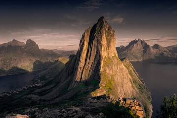 Epic dark landscape of Mount Segla viewed from Mount Hesten after sunset in  Senja Island, Norway