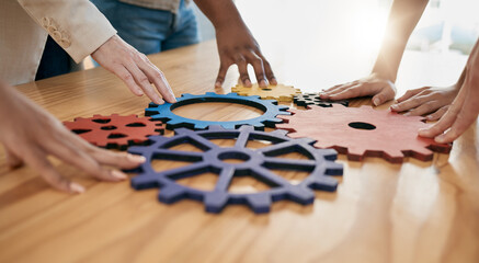 Poster - Hands, collaboration and gear with a business team working together in synergy for innovation at a workshop. Meeting, teamwork and creative with a man and woman employee group at work in the office