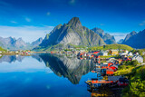 Fototapeta Desenie - Perfect reflection of the Reine village on the water of the fjord in the Lofoten Islands,  Norway