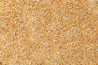 Breadcrumbs, crushed dried bread, background uniform texture, bunch in bulk close-up macro top view