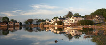 Houses Are Reflected In Calm Early Morning Waters Along Connecticut's Shore.