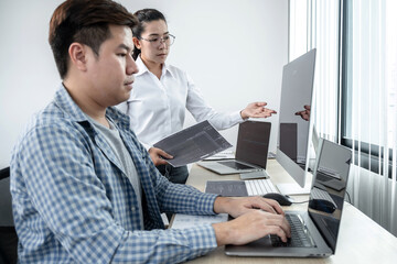 Wall Mural - team of two professional programmers working on website projects in software development on the desk