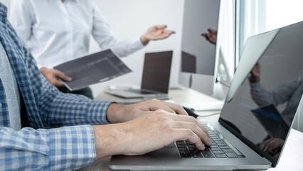 Wall Mural - team of two professional programmers working on website projects in software development on the desk