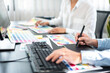 © Freedomz - Two creative graphic designer team working on color selection and drawing on graphic tablet, Color swatch samples chart for selection coloring in inspiration to creativity at workplace