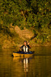 © Cavan Images - Elderly man paddling sea-kayak on small creek near Irondequoit Bay, Rochester, New York, USA.