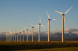 © Cavan Images - Windmills used for power generation at sunrise, near Pincher Creek, Alberta, Canada.