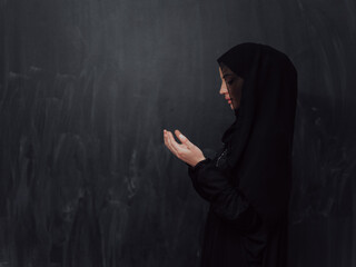 Wall Mural - Portrait of young Muslim woman making dua