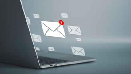 Email notification alert, E-mail marketing concept Businessman using laptop with  mail message on virtual screen sending or reply online communication  social advertisement contact.