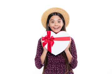 Poster - Child with gift present box on isolated white background. Presents for birthday, Valentines day, New Year or Christmas. Portrait of happy smiling teenage child girl.