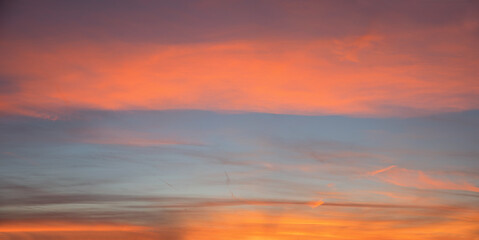 Wall Mural - sky background with superimposed bands of colored clouds