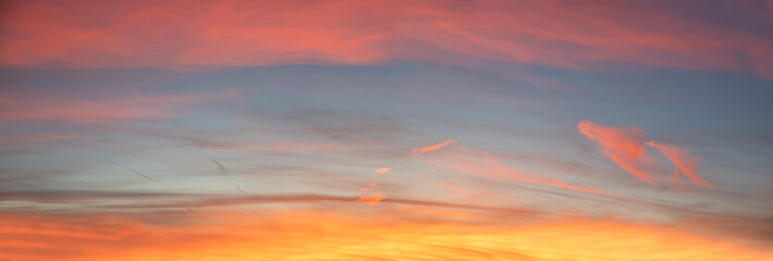 Wall Mural - sky background with superimposed bands of colored clouds