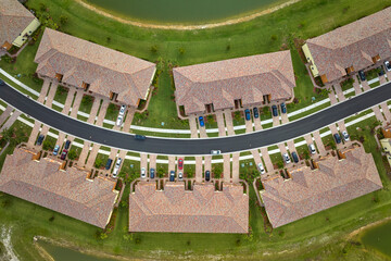 Wall Mural - Aerial view of tightly packed homes in Florida closed living clubs. Family houses as example of real estate development in american suburbs